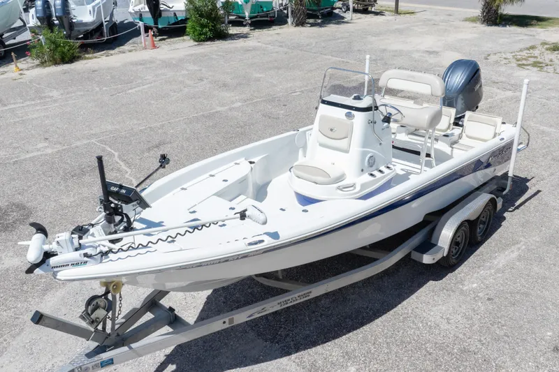 Slide: The Image of 2015 NauticStar 214 XTS boat on trailer, featuring sleek design and modern equipment. - 3