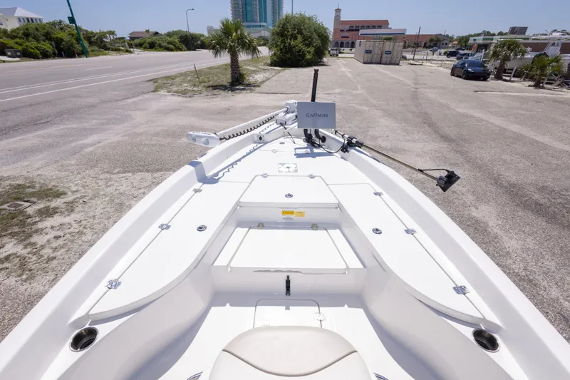Slide: The Image of 2015 NauticStar 214 XTS boat with Garmin equipment, parked on a sunny day. - 33