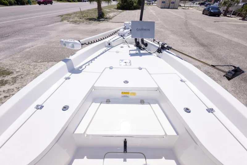 Slide: The Image of 2015 NauticStar 214 XTS boat deck with Garmin equipment, parked on a sunny day. - 36