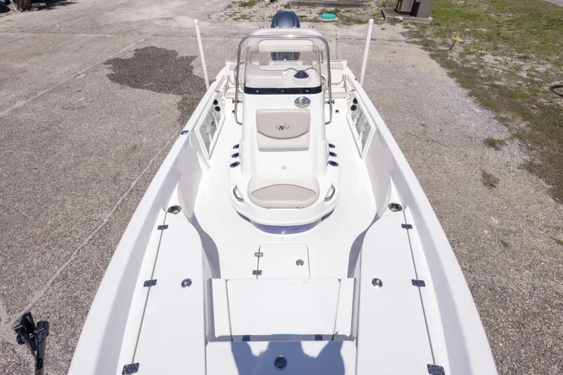 Slide: The Image of 2015 NauticStar 214 XTS boat, top view, showcasing spacious deck and seating arrangement. - 39