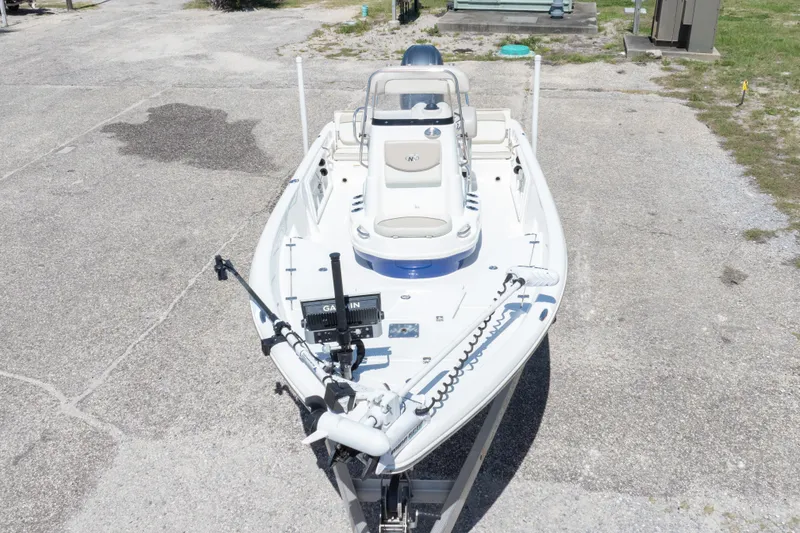 Slide: The Image of 2015 NauticStar 214 XTS boat on trailer, viewed from above, parked on concrete. - 4