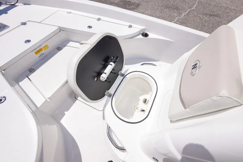 Slide: The Image of 2015 NauticStar 214 XTS boat interior with open storage compartment and seating. - 40