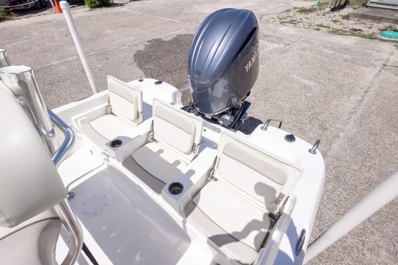 Slide: The Image of 2015 NauticStar 214 XTS boat with Yamaha outboard motor and seating area. - 45