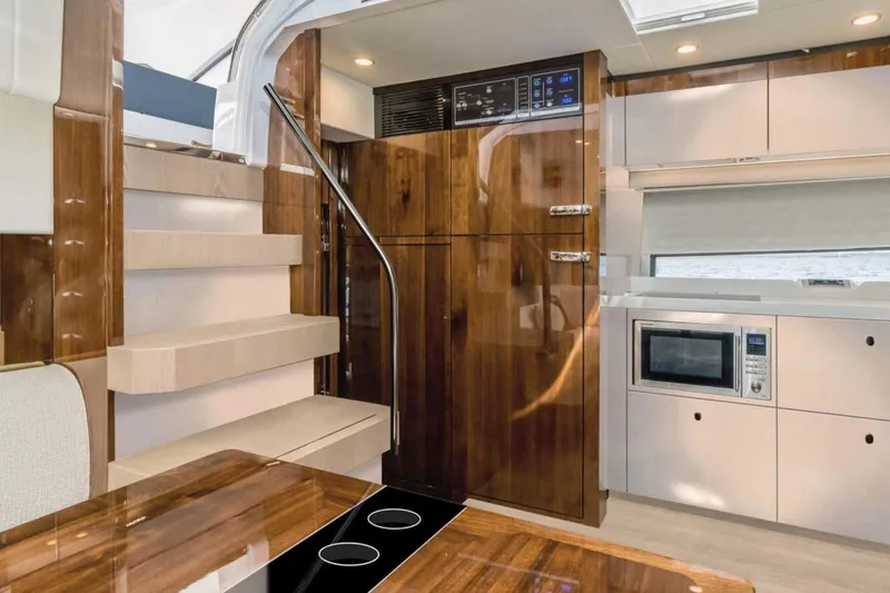 Slide: The Image of Manufacturer Provided Image: Luxurious interior of 2026 Fairline Targa 50 Edition yacht with modern kitchen amenities. - 6