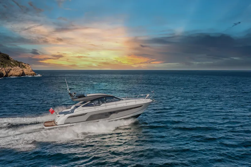 The Image of 2026 Fairline Targa 50 Edition yacht cruising at sunset on open sea. - 0
