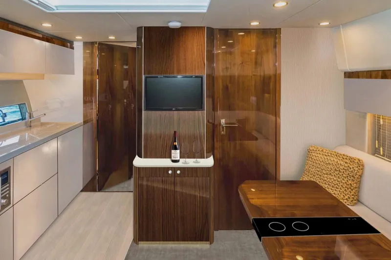 Slide: The Image of Manufacturer Provided Image: Luxurious interior of 2026 Fairline Targa 50 Edition yacht with modern kitchen and seating area. - 5