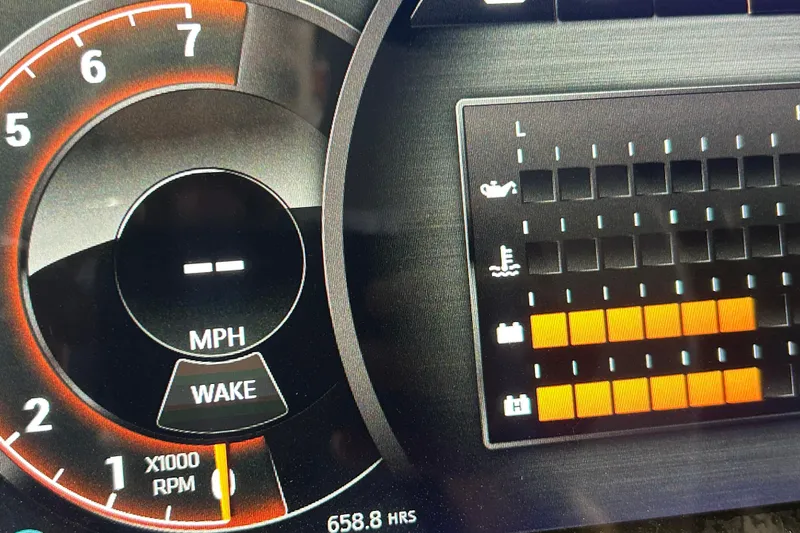 Slide: The Image of Dashboard of 2018 Sea Ray SLX-W 230 boat showing speed and engine indicators. - 11