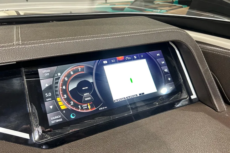 Slide: The Image of Dashboard display of a 2018 Sea Ray SLX-W 230 boat, showing speed and navigation controls. - 15