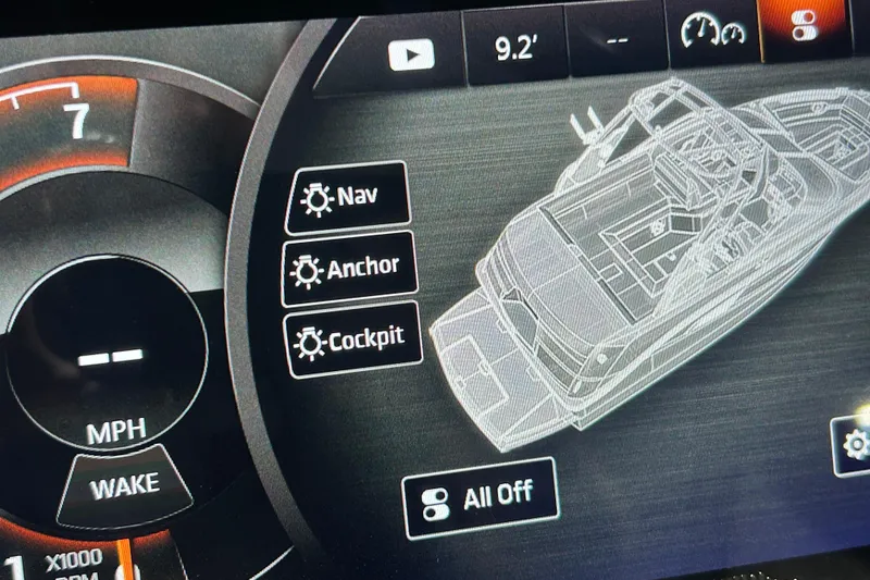 Slide: The Image of Dashboard of 2018 Sea Ray SLX-W 230 boat with navigation and control options. - 16