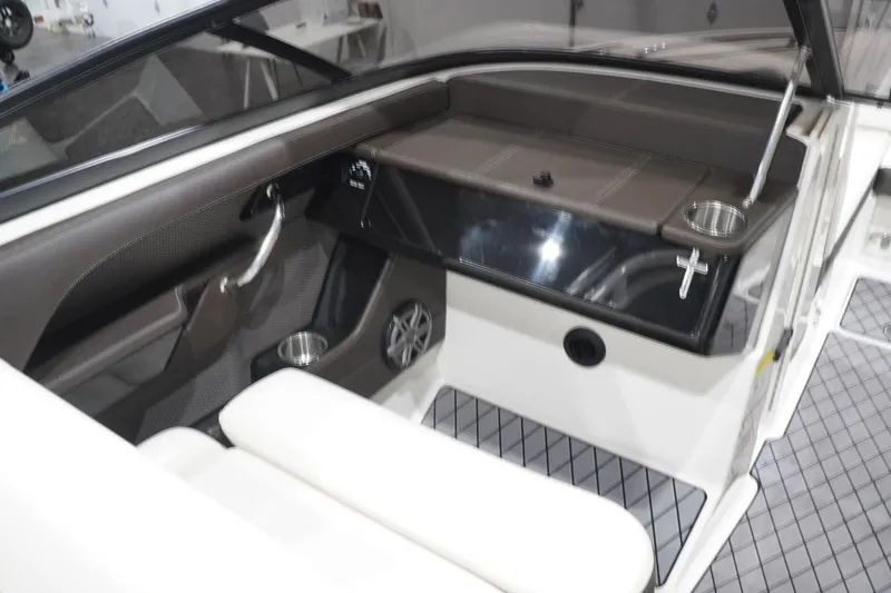 Slide: The Image of Interior of 2018 Sea Ray SLX-W 230 boat, featuring sleek seating and modern dashboard design. - 25