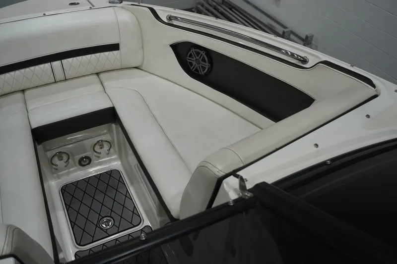 Slide: The Image of 2018 Sea Ray SLX-W 230 boat interior with white leather seating and sleek design. - 28