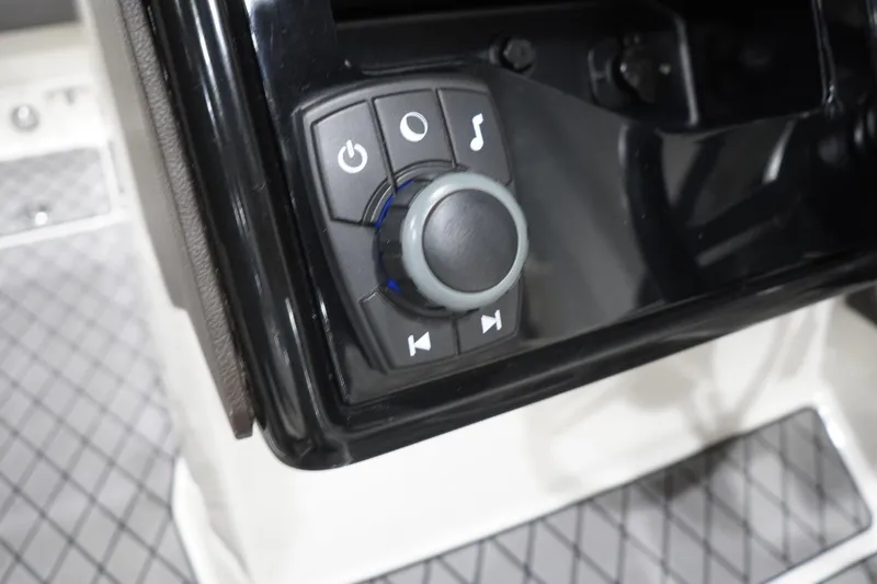 Slide: The Image of Control panel of 2018 Sea Ray SLX-W 230 boat with power and music buttons. - 32