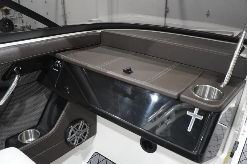 Slide: The Image of 2018 Sea Ray SLX-W 230 boat interior with cup holders and sleek dashboard design. - 35