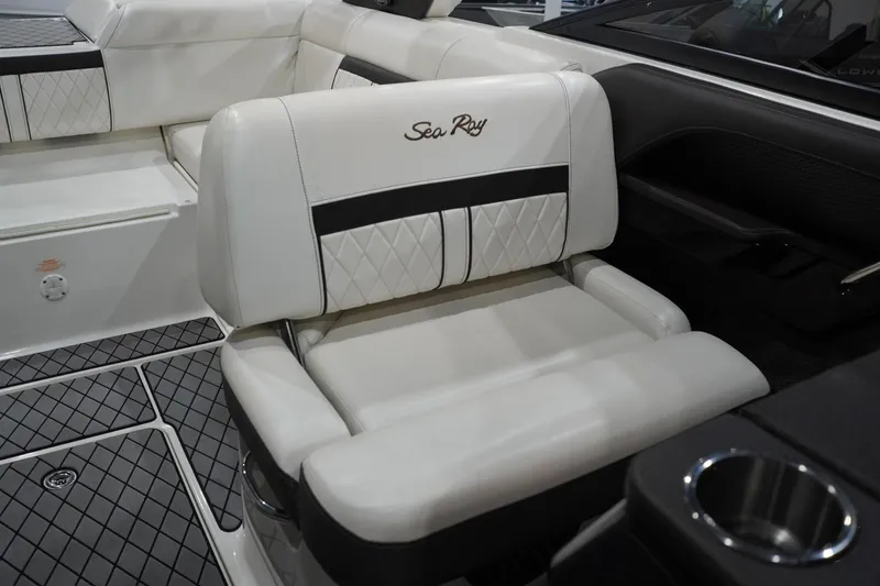 Slide: The Image of Luxurious interior seating of 2018 Sea Ray SLX-W 230 boat, featuring elegant white upholstery. - 36