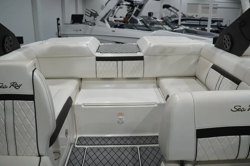 Slide: The Image of Luxurious interior of 2018 Sea Ray SLX-W 230 boat with white leather seating. - 38