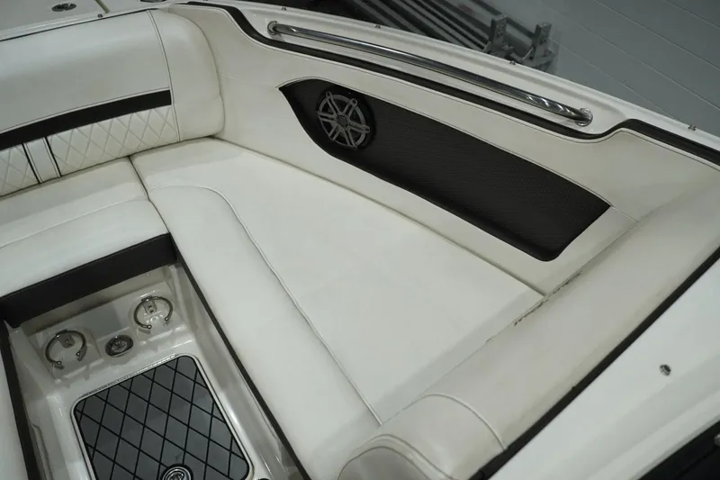 Slide: The Image of Interior seating of 2018 Sea Ray SLX-W 230 boat with white upholstery and speaker. - 41