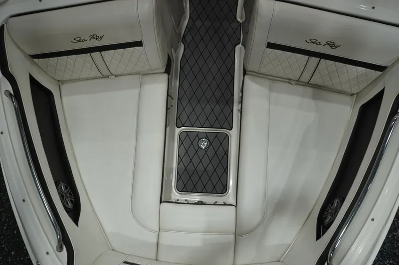 Slide: The Image of 2018 Sea Ray SLX-W 230 boat interior with white seating and black accents. - 44