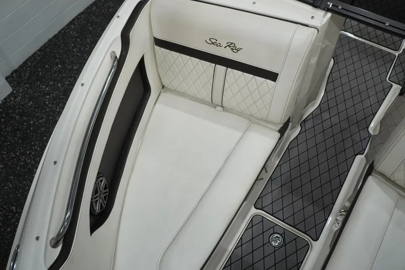 Slide: The Image of 2018 Sea Ray SLX-W 230 boat interior with white quilted seating and sleek design. - 45