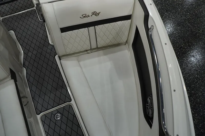 Slide: The Image of Interior of 2018 Sea Ray SLX-W 230 boat with white seating and diamond-patterned flooring. - 46