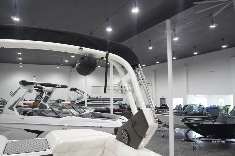 Slide: The Image of Indoor showroom displaying 2018 Sea Ray SLX-W 230 boats with sleek design and modern features. - 50