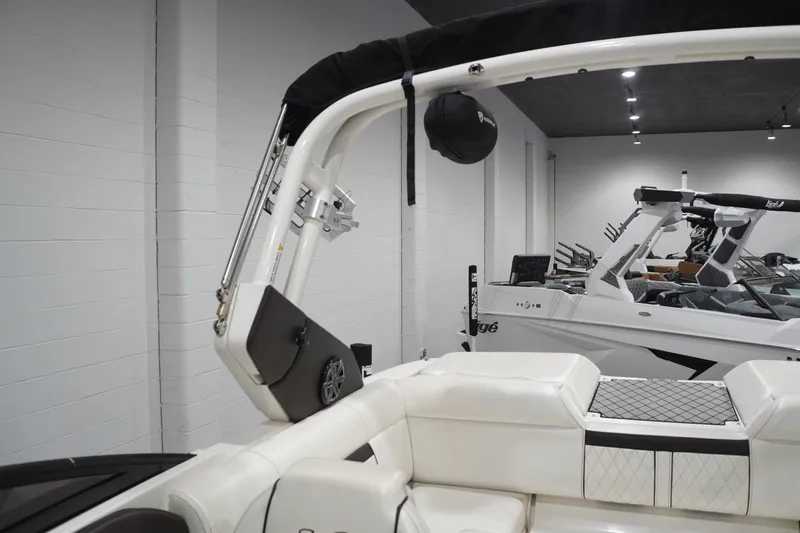 Slide: The Image of 2018 Sea Ray SLX-W 230 boat interior with white seating and sleek design. - 52