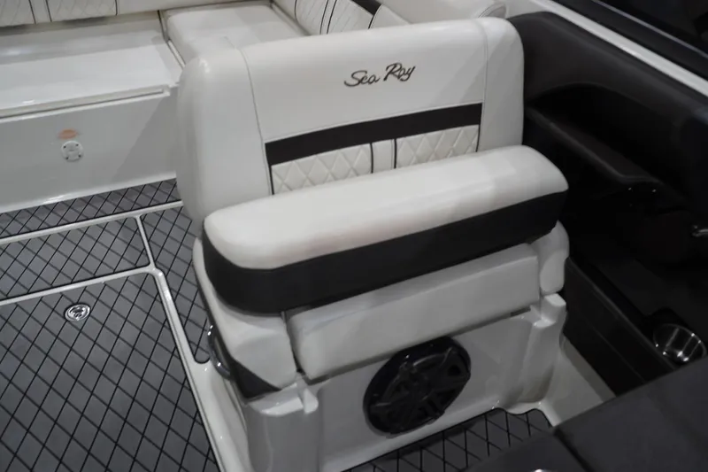 Slide: The Image of 2018 Sea Ray SLX-W 230 boat interior with cushioned seating and stylish flooring. - 53