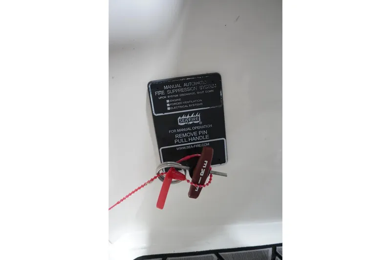 Slide: The Image of 2018 Sea Ray SLX-W 230 fire suppression system manual operation panel. - 56