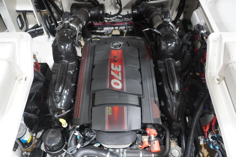 Slide: The Image of Engine compartment of a 2018 Sea Ray SLX-W 230 boat, featuring a powerful 370 HP engine. - 59
