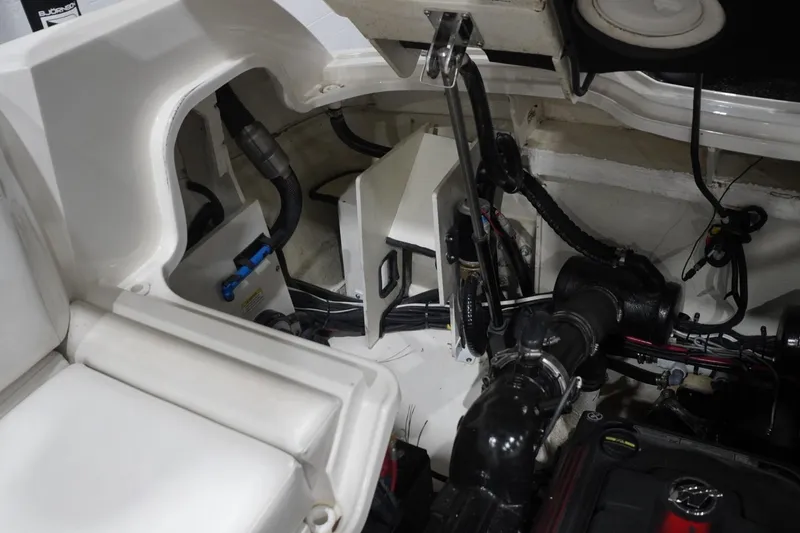 Slide: The Image of Engine compartment of 2018 Sea Ray SLX-W 230 boat, showcasing mechanical components and wiring. - 60