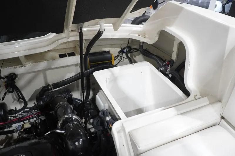 Slide: The Image of Engine compartment of 2018 Sea Ray SLX-W 230 boat, showcasing mechanical components and wiring. - 61