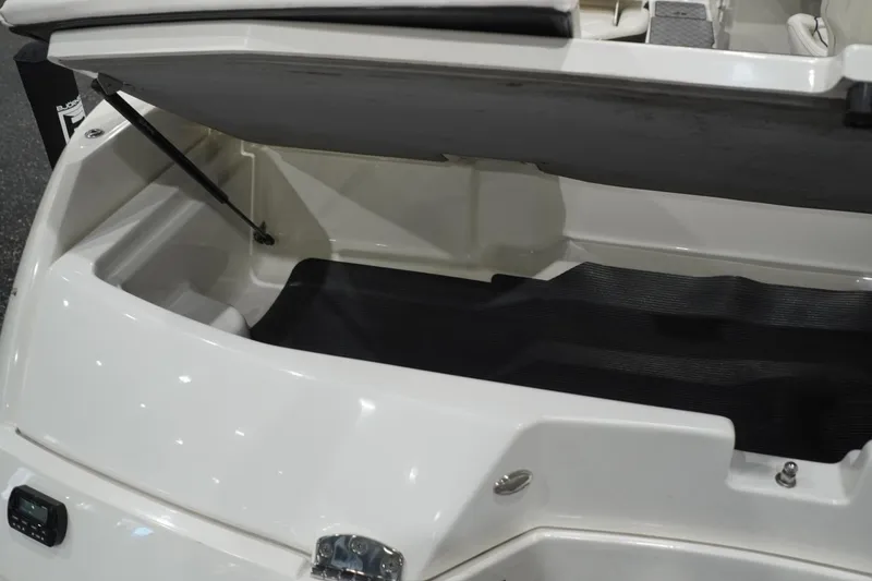 Slide: The Image of Open storage compartment of 2018 Sea Ray SLX-W 230 boat, showcasing interior space. - 63