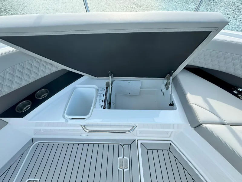 Slide: The Image of Open storage compartment on 2025 Cruisers Yachts 50 GLS Outboard. - 26