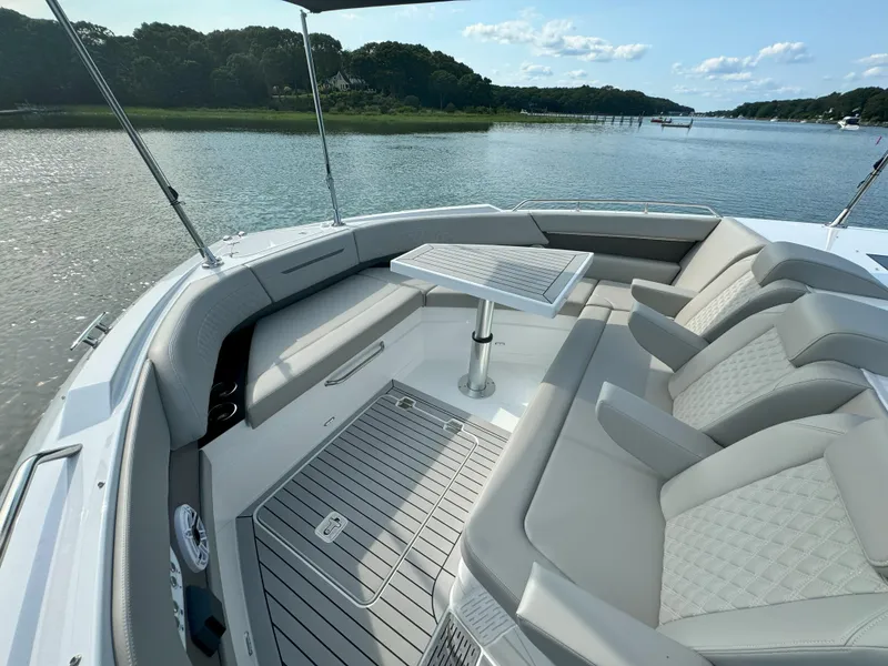 Slide: The Image of 2025 Cruisers Yachts 50 GLS Outboard, luxury seating area on deck. - 29