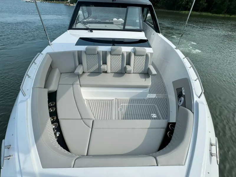 Slide: The Image of Luxurious cockpit of the 2025 Cruisers Yachts 50 GLS on calm waters. - 32