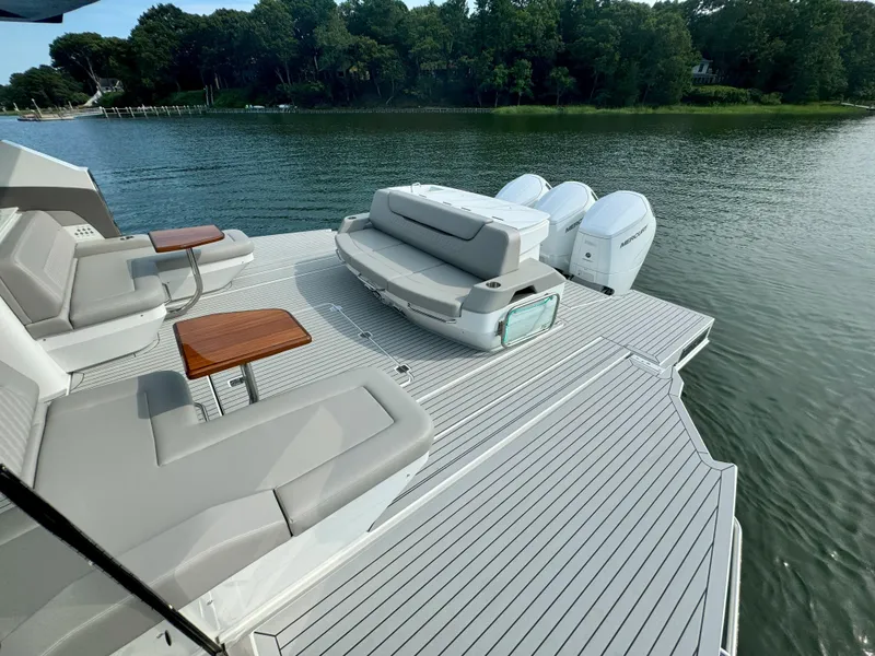 Slide: The Image of Luxurious Cruisers Yachts 50 GLS deck with seating area, 2025 model. - 34