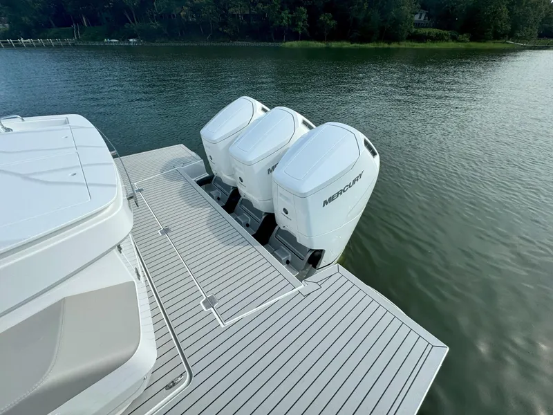 Slide: The Image of Cruisers Yachts 50 GLS 2025 with three Mercury outboard engines. - 35