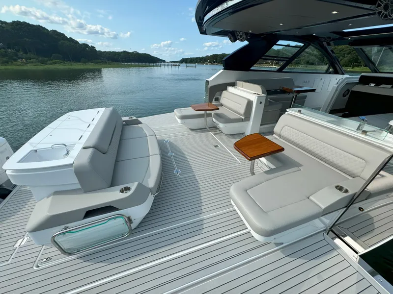 Slide: The Image of Luxurious Cruisers Yachts 50 GLS deck with sleek seating, 2025 model. - 39
