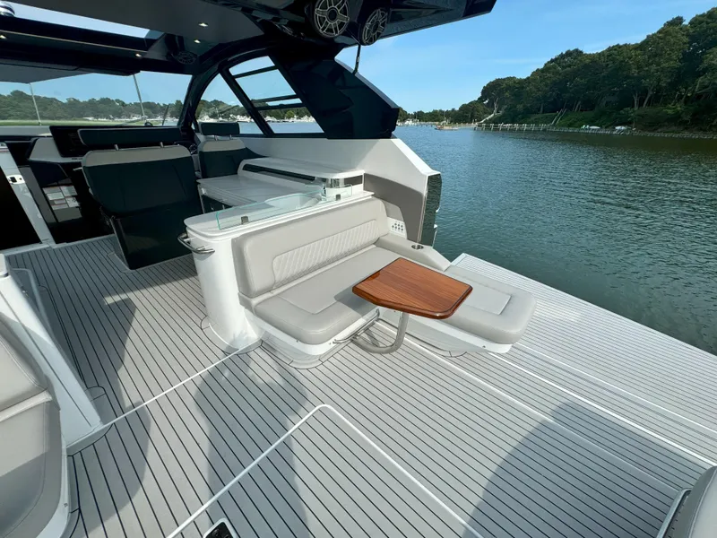 Slide: The Image of Luxurious Cruisers Yachts 50 GLS deck with seating area, 2025 model. - 41