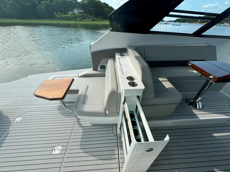 Slide: The Image of Luxurious interior of 2025 Cruisers Yachts 50 GLS with seating and table. - 42