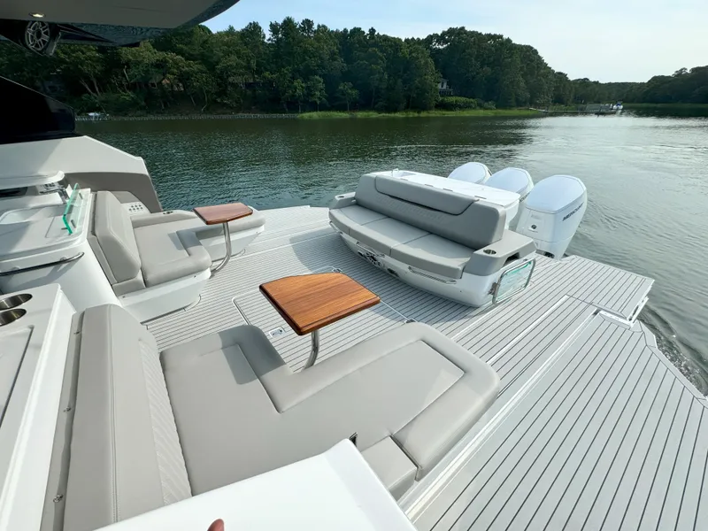 Slide: The Image of Luxurious Cruisers Yachts 50 GLS deck with elegant seating, 2025 model. - 45