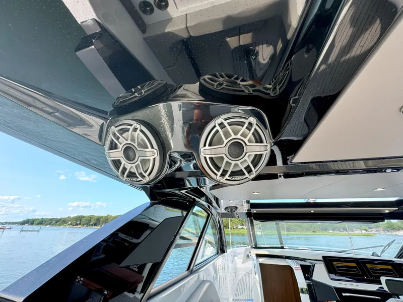 Slide: The Image of Interior of 2025 Cruisers Yachts 50 GLS with modern speakers. - 46