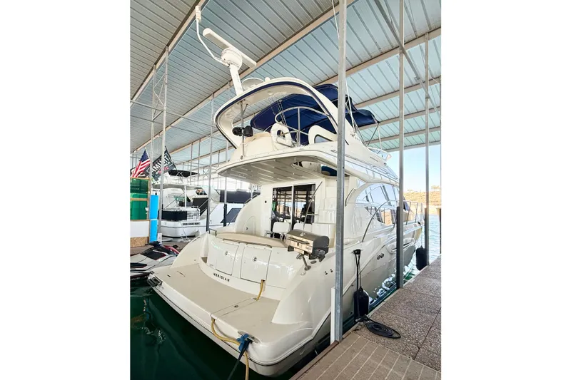 Slide: The Image of 2011 Meridian 391 Sedan yacht docked in a covered marina. - 1