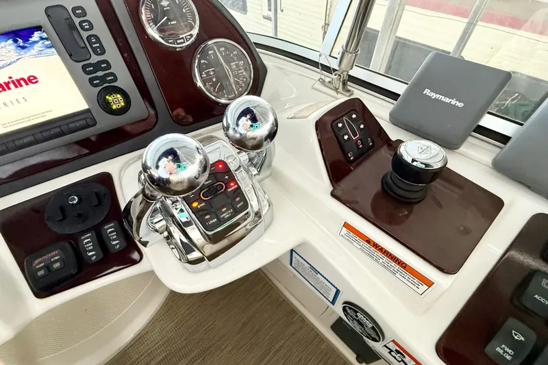 Slide: The Image of Control panel of a 2011 Meridian 391 Sedan boat with navigation instruments. - 10