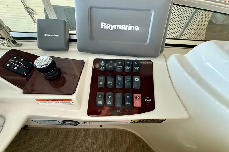 Slide: The Image of Control panel of a 2011 Meridian 391 Sedan with Raymarine navigation equipment. - 11