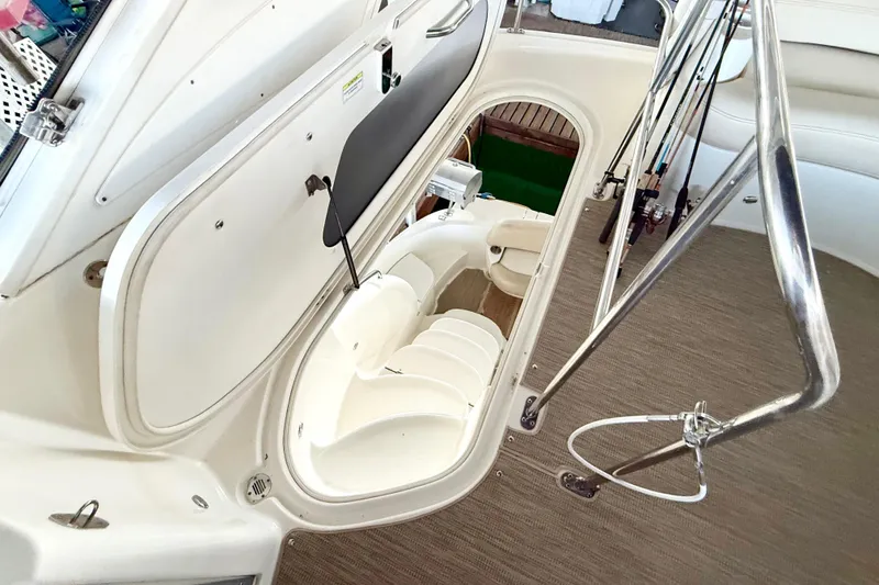 Slide: The Image of Interior view of a 2011 Meridian 391 Sedan yacht, showcasing seating and storage. - 13