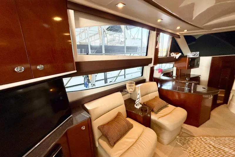 Slide: The Image of Luxurious interior of a 2011 Meridian 391 Sedan yacht with plush seating and elegant decor. - 16