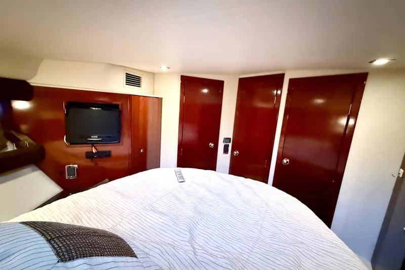Slide: The Image of Luxurious cabin interior of 2011 Meridian 391 Sedan with TV and wooden doors. - 27