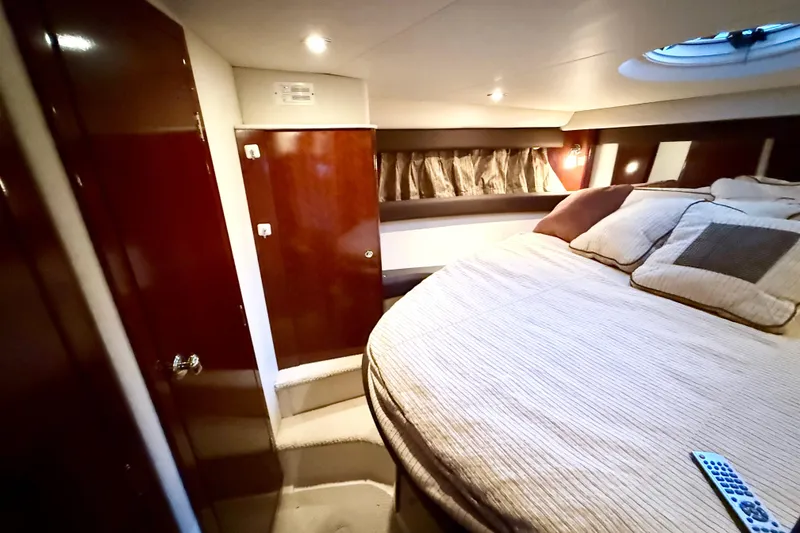 Slide: The Image of Luxurious 2011 Meridian 391 Sedan cabin interior with cozy bedding and elegant wood finishes. - 29
