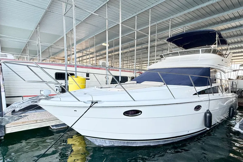 Slide: The Image of 2011 Meridian 391 Sedan yacht docked in a covered marina. - 3