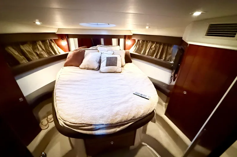 Slide: The Image of Luxurious bedroom interior of 2011 Meridian 391 Sedan yacht with cozy bedding. - 30